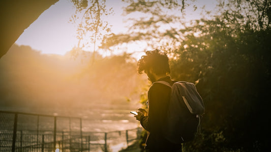silhouette of man and woman kissing during sunset