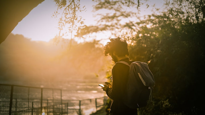 silhouette of man and woman kissing during sunset