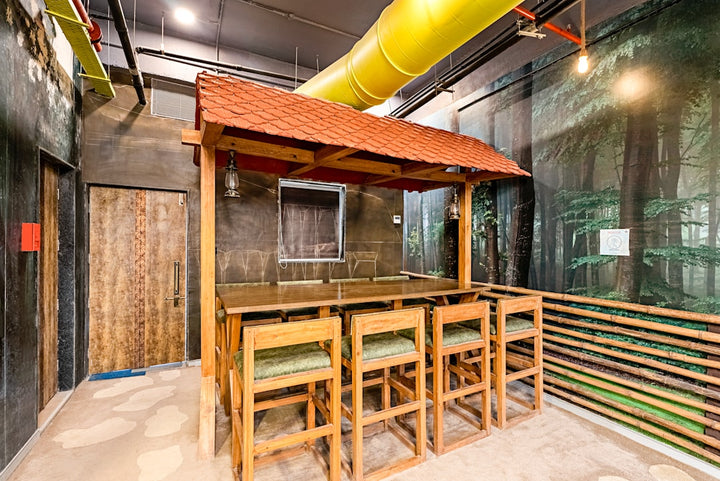 a room that has a wooden table and chairs in it