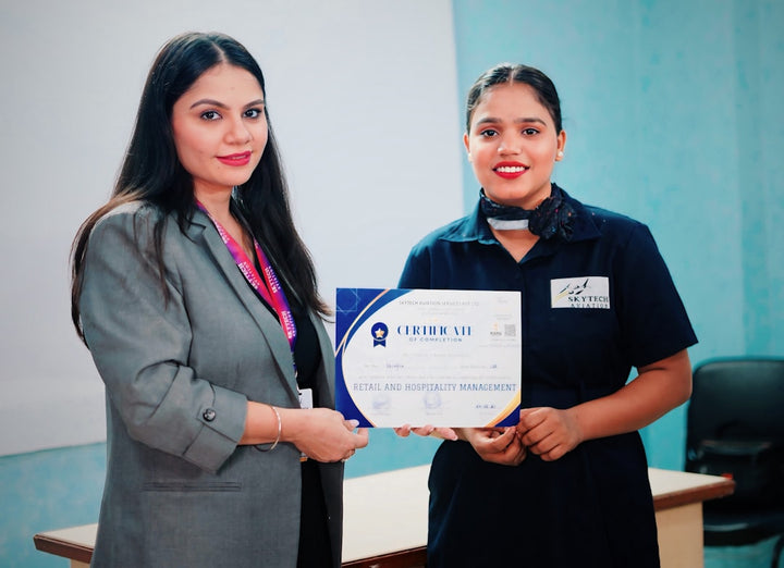 Two women holding a certificate