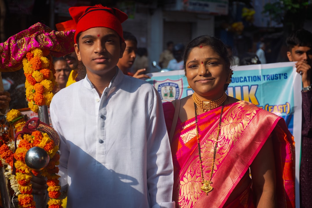 A young man and woman in traditional indian attire.