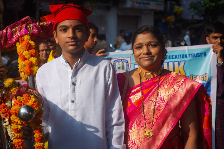 A young man and woman in traditional indian attire.